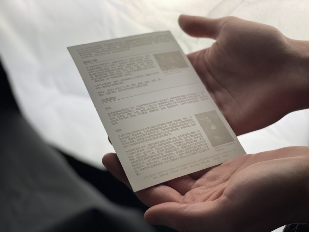 Hands holding clay tablet